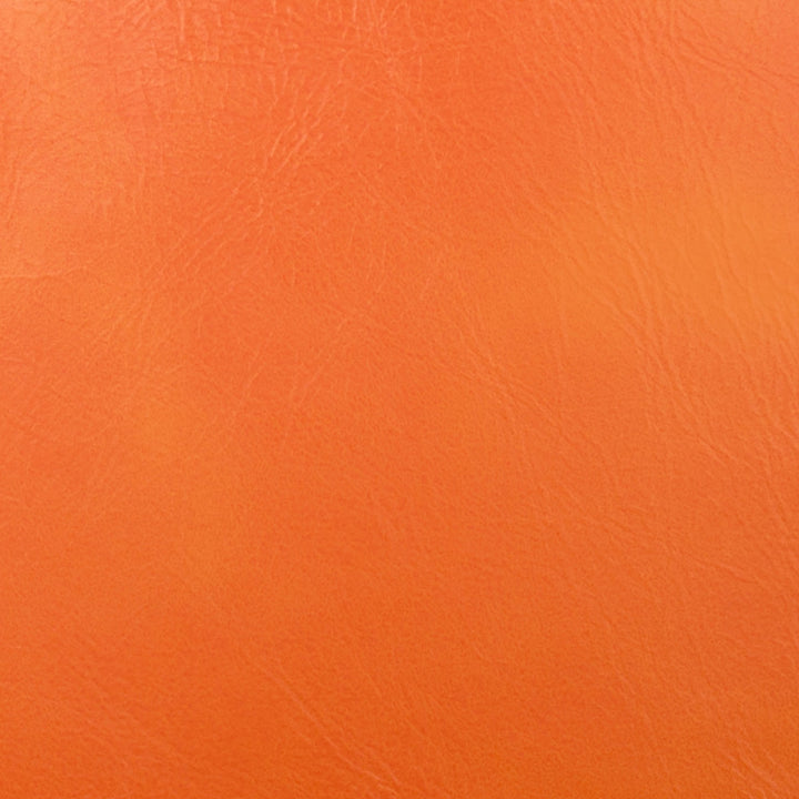 Derma Tangerine by Europatex Fabric Derma Surface: 100% PVC (Phthalate Free) Backing: 100% Polyester 0.00" 54.00 inches - Fabric Carolina -