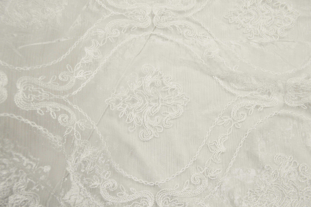 Dora White by Europatex Fabric Majestic 100% Polyester China Horizontal: 11.75 and Vertical: 14.5 110" - Fabric Carolina -