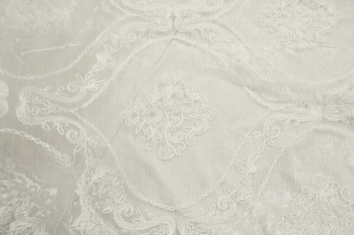 Dora White by Europatex Fabric Majestic 100% Polyester China Horizontal: 11.75 and Vertical: 14.5 110" - Fabric Carolina -