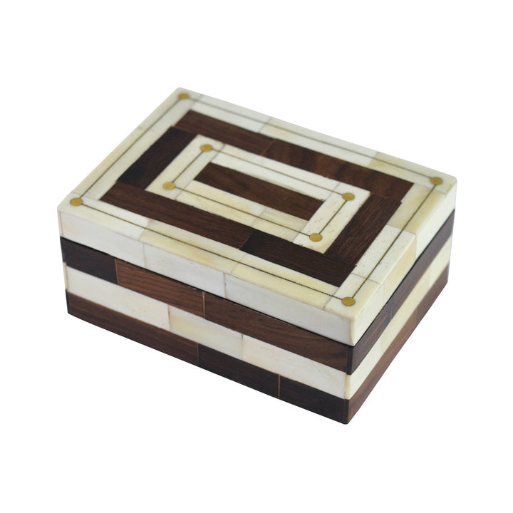 Mesa Box QR-18262.NTRLBROWN.0 by CuratedKravet CuratedKravet A brown and natural colored bone box with constrasting stripes. Features inlaid gold details. India DUST LIGHTLY WITH A SOFT, DRY CLOTH. </p><p>Dimensions: Length 7, Height 3, Width 5 Bone - 50%, Mdf - 50% - Fabric Carolina -