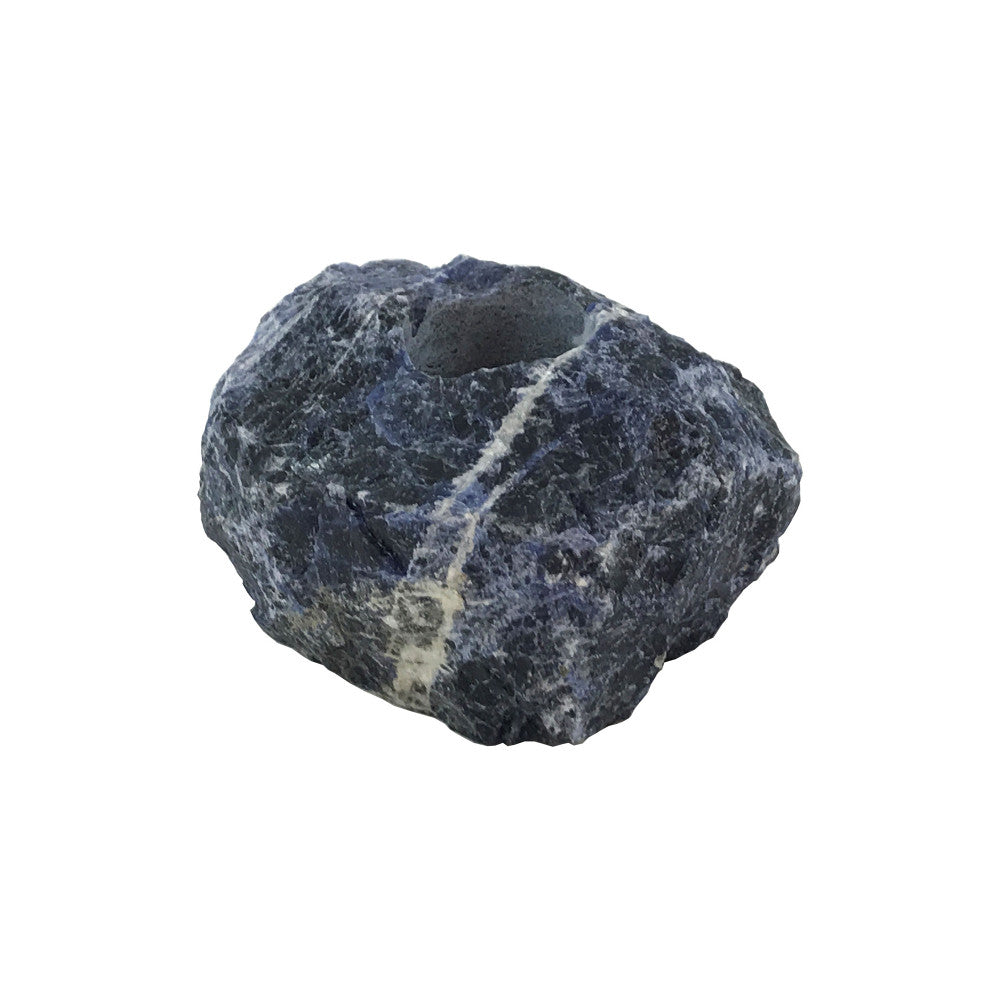 Joao Blue Sodalite Votive Holder QR-18403.BLUE.0 by CuratedKravet CuratedKravet A natural blue sodalite votive holder. Due to the natural material, size, shape and color will vary. The votive holder will range in sizes from: 3"-4.5"L x 3"-4.5"W x 2"-2.75"H. Brazil DUST LIGHTLY. </p><p>Dimensions: Length , Height , Width Stone - 95%, Poly Resin - 5% - Fabric Carolina -