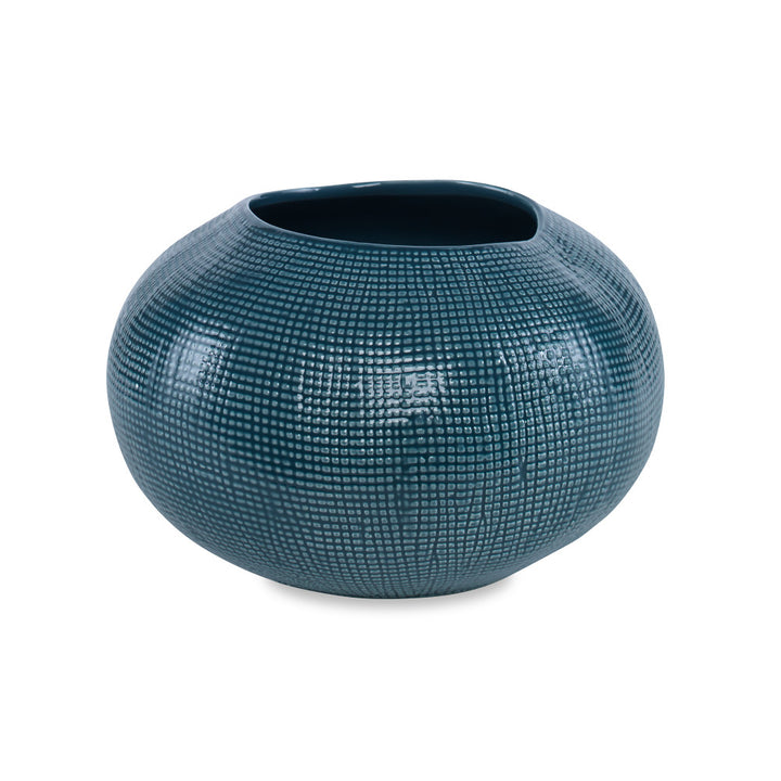 Lennon Bowl QR-20695.DRKGRN.0 by CuratedKravet CuratedKravet An organically shaped earthenware ceramic bowl detailed with sisal-like texture and a dark teal green reactive glaze. Due to the handmade nature of this bowl, variation is to be expected. Portugal </p><p>Dimensions: Length 10.5, Height 6.75, Width 10.5 Ceramic - 100% - Fabric Carolina -