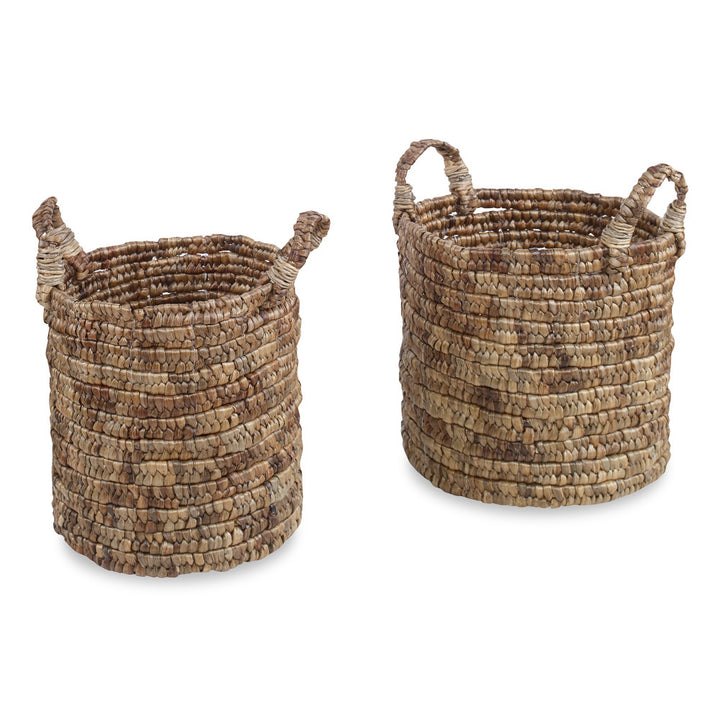 Watters Baskets, Set Of 2 QR-20883.NATURAL.0 by CuratedKravet CuratedKravet A set of two round baskets with handles. Size, shape and color may vary slightly due to the handmade nature of this product. Small: 13.75"L x 13.75"W x 14.5"H (18.5"H with handles); Large: 15.25"L x 15.25"W x 15.25"H (19.25"H with handles) Indonesia </p><p>Dimensions: Length , Height , Width Water Hyacinth - 100% - Fabric Carolina -