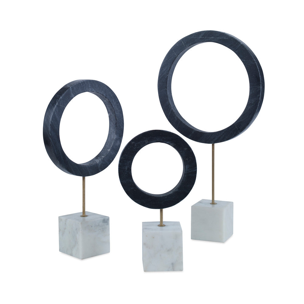 Vance Sculpture Black, Set Of 3 QR-21083.BLACK.0 by CuratedKravet CuratedKravet A set of 3 black marble rings mounted on white marble cube bases. Due to the natural material, variation to be expected. Small: 6"L x 3"W x 10.5"H; Medium: 7.75"L x 3"W x 14.5"H; Large: 10"L x 3"W x 18.5"H India </p><p>Dimensions: Length , Height , Width Marble - 95%, Metal - 5% - Fabric Carolina -