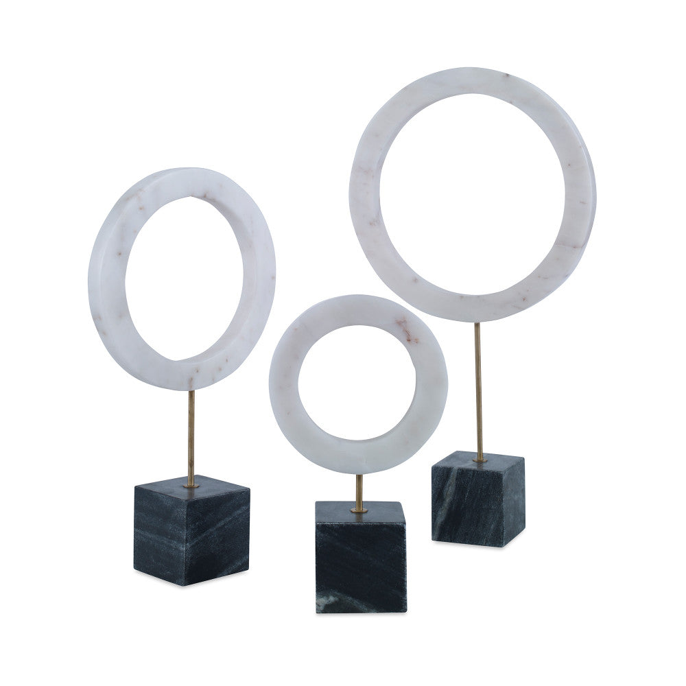 Vance Sculpture White, Set Of 3 QR-21083.WHITE.0 by CuratedKravet CuratedKravet A set of 3 white marble rings mounted on black marble cube bases. Due to the natural material, variation is to be expected. Small: 6"L x 3"W x 10.5"H; Medium: 7.75"L x 3"W x 14.5"H; Large: 10"L x 3"W x 18.5"H India </p><p>Dimensions: Length , Height , Width Marble - 95%, Metal - 5% - Fabric Carolina -
