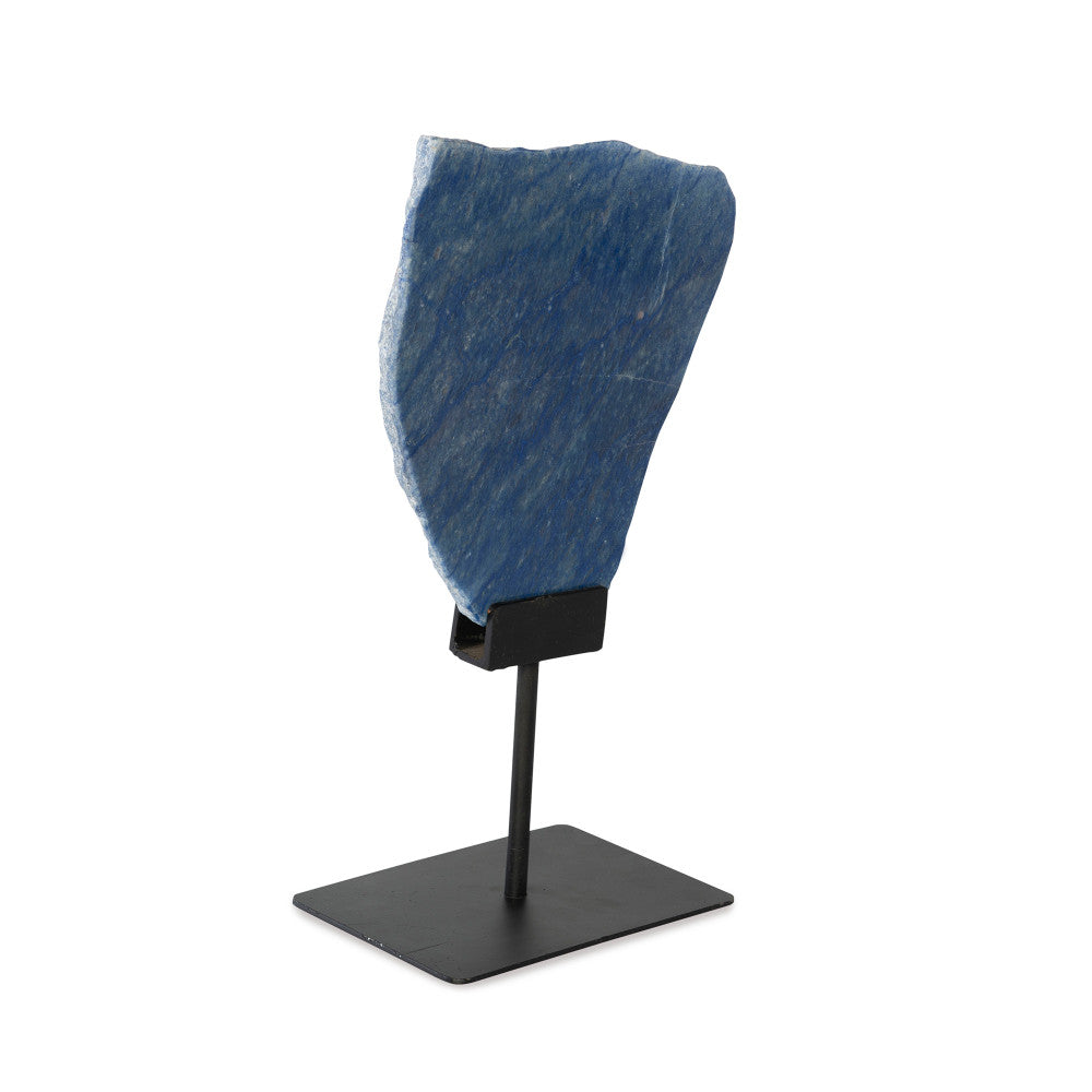 Olinda Sculpture QR-21905.BLUE.0 by CuratedKravet CuratedKravet A slice of blue quartz mounted on a black iron base. Due to the natural material, variation in size, shape and color is to be expected. Base only measures: 8"L x 6"W x 7.25"H. Overall height with the slab can range from 13.75"-17.75"H. Brazil DUST LIGHTLY WITH A SOFT, DRY CLOTH. </p><p>Dimensions: Length , Height , Width Iron - 50%, Stone - 50% - Fabric Carolina -