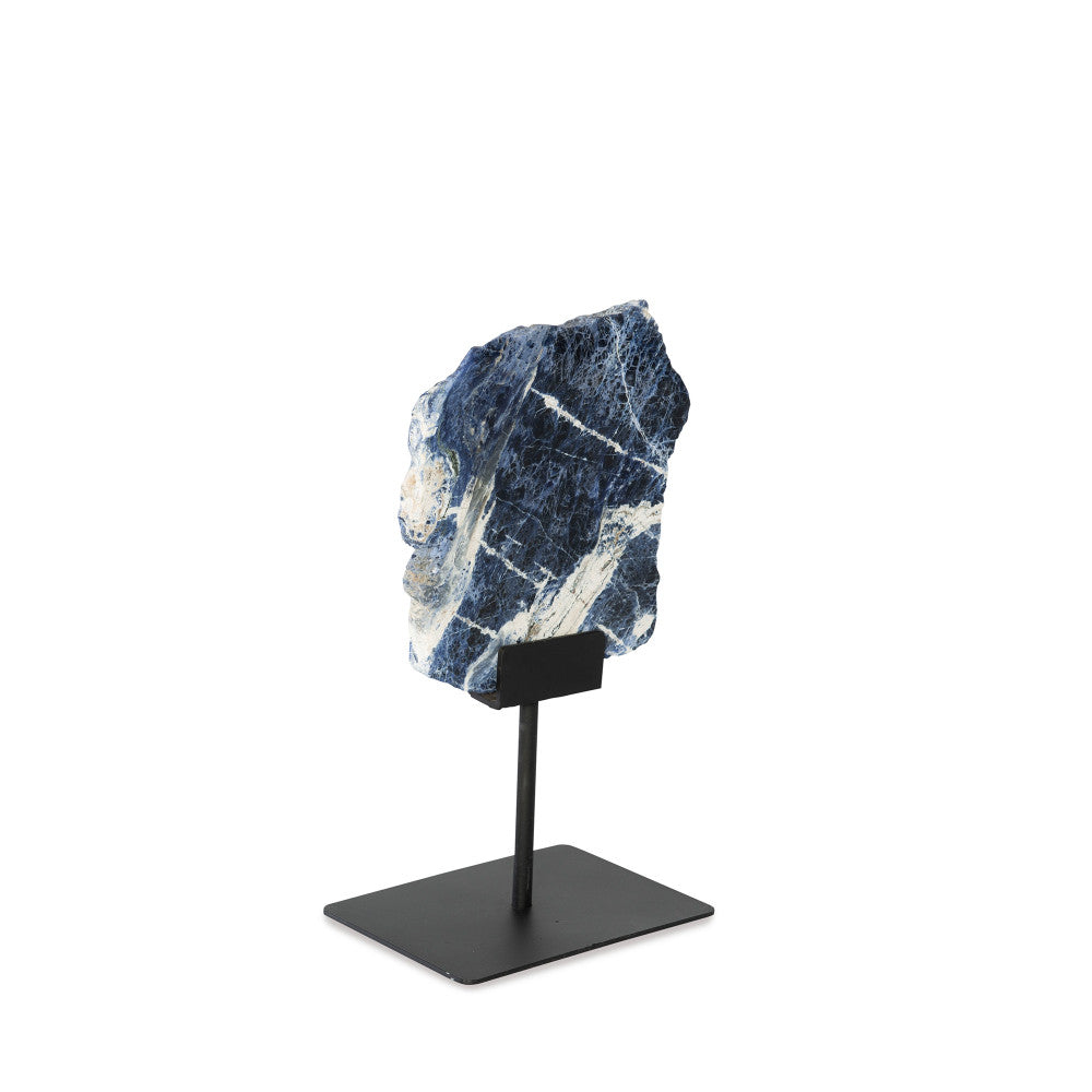 Dez Sculpture QR-21905.SODALITE.0 by CuratedKravet CuratedKravet A slice of sodalite mounted on a black iron base. Due to the natural material, variation in size, shape and color is to be expected. Base only measures: 8"L x 6"W x 7.25"H. Overall height with the slab can range from 13.75"-17.75"H. Brazil DUST LIGHTLY WITH A SOFT, DRY CLOTH. </p><p>Dimensions: Length , Height , Width Iron - 50%, Stone - 50% - Fabric Carolina -