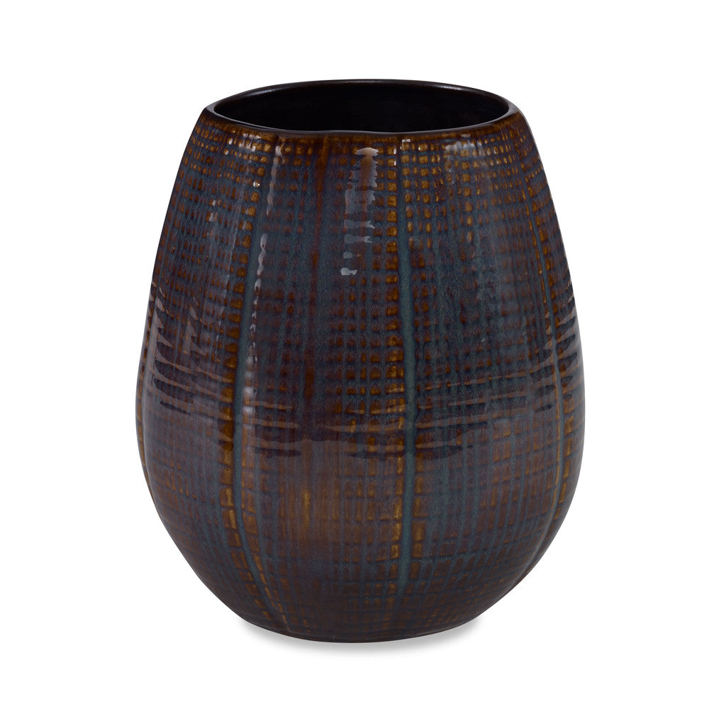 Caprio Vase, Small QR-22870.BLUBRWN.0 by CuratedKravet CuratedKravet A textured ceramic vase featuring a reactive blue and brown finish. Each vase is handmade and unique. This vase is not watertight. Portugal DUST LIGHTLY WITH A SOFT, DRY CLOTH. </p><p>Dimensions: Length 7, Height 8, Width 7 Ceramic - 100% - Fabric Carolina -