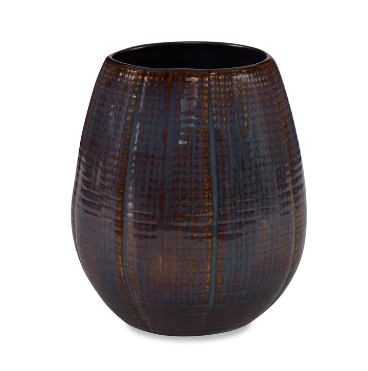 Caprio Vase, Small QR-22870.BLUBRWN.0 by CuratedKravet CuratedKravet A textured ceramic vase featuring a reactive blue and brown finish. Each vase is handmade and unique. This vase is not watertight. Portugal DUST LIGHTLY WITH A SOFT, DRY CLOTH. </p><p>Dimensions: Length 7, Height 8, Width 7 Ceramic - 100% - Fabric Carolina -