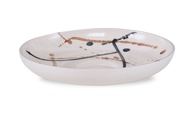 Walden Bowl QR-22983.SPLATTER.0 by CuratedKravet CuratedKravet A low ceramic bowl detailed with a splatter glaze design in black and brown tones, contrasted against a creamy crackled glaze. Due to the handmade nature of this product, variation is to be expected. Portugal </p><p>Dimensions: Length , Height , Width Ceramic - 100% - Fabric Carolina -