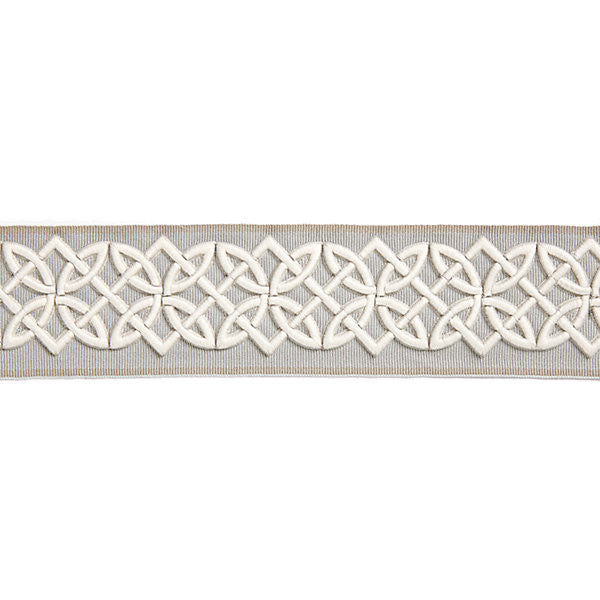 Celtic Embroidered Tape/Silver Grey by Scalamandre Trim Scalamandre Trim Celtic Embroidered Tape/Silver GreyTrim HAMPTONS TRIMMINGS 40% POLYESTER 32% VISCOSE 28% ACRYLIC CHINA </p><p>Repeat: H: 1.875", V: 2.75" - Fabric Carolina -