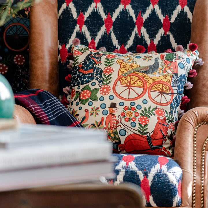 FASNACHT Cushion (LC40193) by Mind The Gap | LC40193 | TYROL APRES-SKI HOME COLLECTION | 20 x 20 in | Blue, Green, Red, Taupe | Fabric Carolina | https://www.fabriccarolina.com/