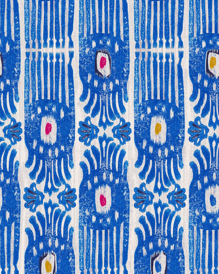 IKAT Carnival Wallpaper (WP20817) by Mind The Gap | WP20817 | MINNIE KEMP X MINDTHEGAP | 1 roll x 20.47 x 354.33 in | 0.52m / 20.5in | 9m / 354in | 4.68mp | 70cm / 27.6in | Blue, Red, White, Yellow | Non-woven | Paste the wall | 1-roll in a box | Fabric Carolina | https://www.fabriccarolina.com/