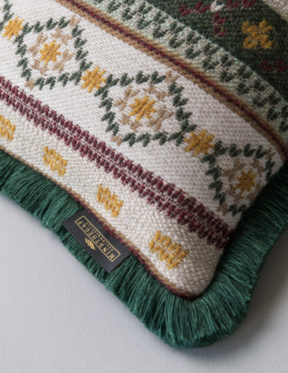 GAISSTEIN Cushion - Rectangular (LC40196) by Mind The Gap | LC40196 | TYROL APRES-SKI | 50 x 30 cm | Taupe, Light Green, Dark Green | Fringes all around | Duck feather | 40% Cotton, 27% Polyacrylic, 20% Wool, 13% Other Fibers | Fabric Carolina | https://www.fabriccarolina.com/
