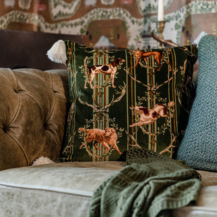MOUNTAIN DOGS Cypress Green Velvet Cushion (LC40180) by Mind The Gap | LC40180 | TYROL APRES-SKI HOME COLLECTION | 20 x 20 in | Brown, Green, Taupe, Yellow | Fabric Carolina | https://www.fabriccarolina.com/