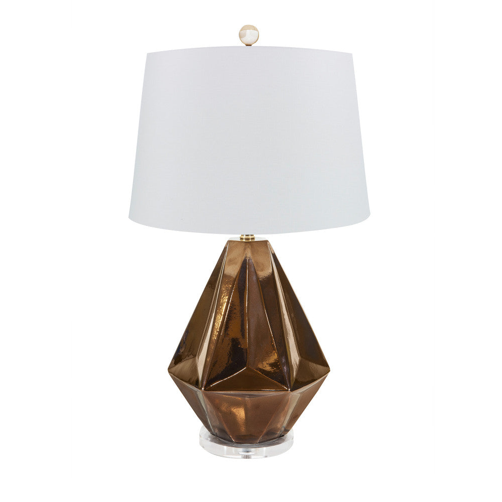 Liza Table Lamp QR-16105.BRONZE.0 by CuratedKravet CuratedKravet A faceted ceramic table lamp featuring a metallic bronze finish and a clear acrylic base. Topped with a hardback ivory linen drum shade. Detailed with a clear crystal ball finial. Made in the USA. United States </p><p>Dimensions: Length 14, Height 25, Width 14 Ceramic - 50%, Linen - 40%, Brass - 5%, Crystal Stone - 5% - Fabric Carolina -