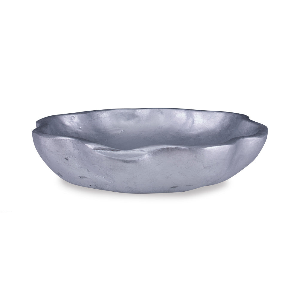 Lisso Bowl QR-18762.SLVRLEAF.0 by CuratedKravet CuratedKravet A silver leafed scalloped bowl made of resin. Cast from a one of a kind wooden bowl sourced from Asia. The natural imperfections of the bowl are captured in this resin version, adding character and texture. United States DUST LIGHTLY. </p><p>Dimensions: Length 17, Height 3.75, Width 17 Poly Resin - 90%, Silver Leaf - 10% - Fabric Carolina -