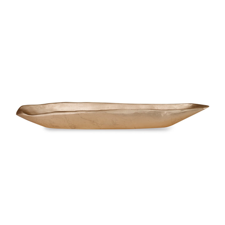 Jada Bowl QR-18763.GOLDLEAF.0 by CuratedKravet CuratedKravet A gold leafed oblong bowl made of resin. Cast from a one of a kind wooden bowl sourced from Asia. The natural imperfections of the bowl are captured in this resin version, adding character and texture. United States DUST LIGHTLY. </p><p>Dimensions: Length 26.5, Height 2.75, Width 6.25 Poly Resin - 90%, Gold Leaf - 10% - Fabric Carolina -