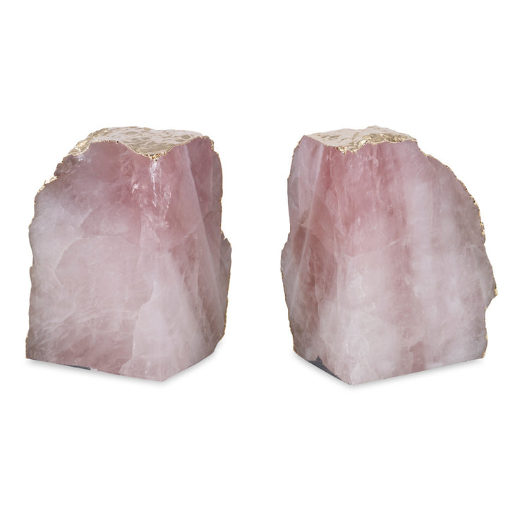 Jacarei Bookends QR-18786.PINKGLD.0 by CuratedKravet CuratedKravet A pair of natural rose quartz bookends, accented with gold plating on the exterior. Due to the natural material, variation in size, color, and shape is to be expected. Measures: 4.75"-6.75"L x 1.5"-2.75"W x 6.75"H Brazil FRAGILE, HANDLE WITH CARE. DUST LIGHTLY WITH A SOFT, DRY CLOTH. </p><p>Dimensions: Length , Height , Width Quartz - 95%, Gold - 5% - Fabric Carolina -