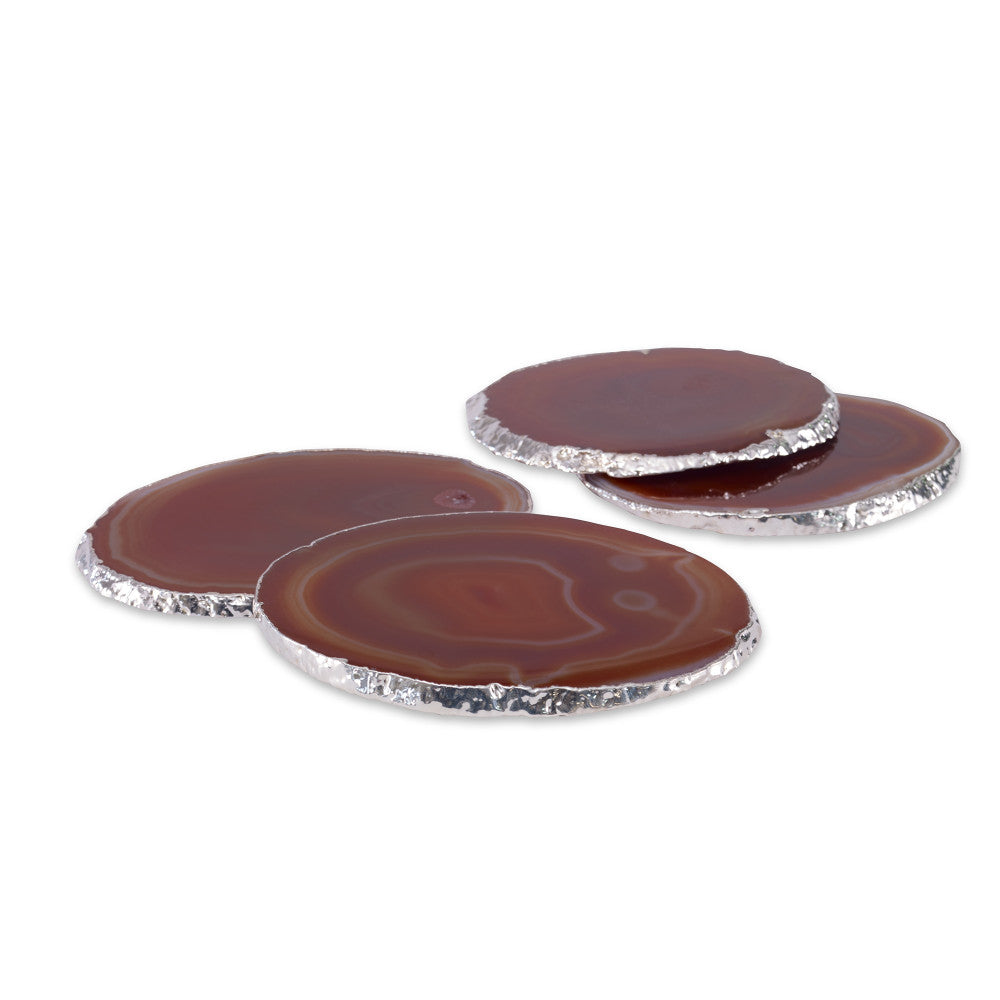 Andre Coasters, Red QR-18874.REDSLVR.0 by CuratedKravet CuratedKravet A set of four red agate slice coasters, detailed with silver electroplated edges. Due to the natural material, size, shape and color will vary. Brazil DUST LIGHTLY. </p><p>Dimensions: Length 3.5, Height 1.25, Width 4.25 Stone - 90%, Silver Leaf - 10% - Fabric Carolina -