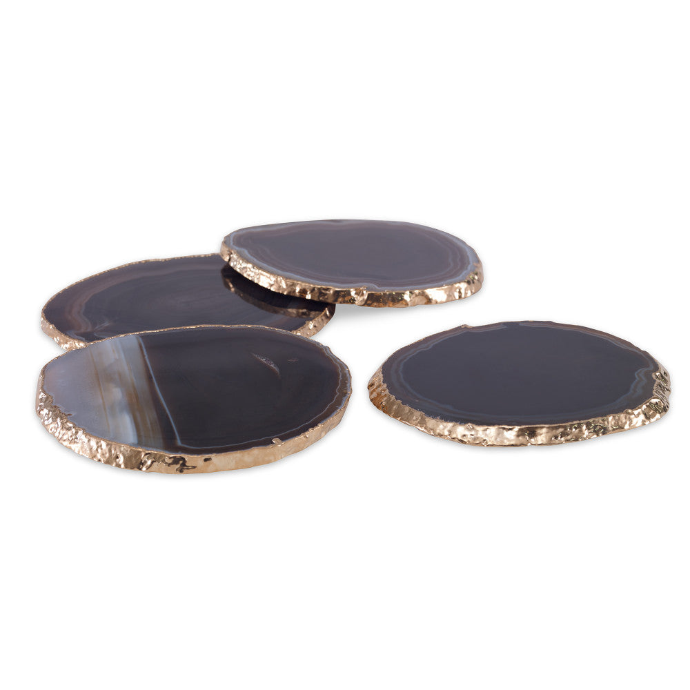 Andre Coasters, Black QR-18875.BLACKGLD.0 by CuratedKravet CuratedKravet A set of four black agate slice coasters, detailed with gold electroplated edges. Due to the natural material, size, shape and color will vary. Brazil DUST LIGHTLY. </p><p>Dimensions: Length 3.5, Height 1.25, Width 4.25 Stone - 90%, Gold - 10% - Fabric Carolina -