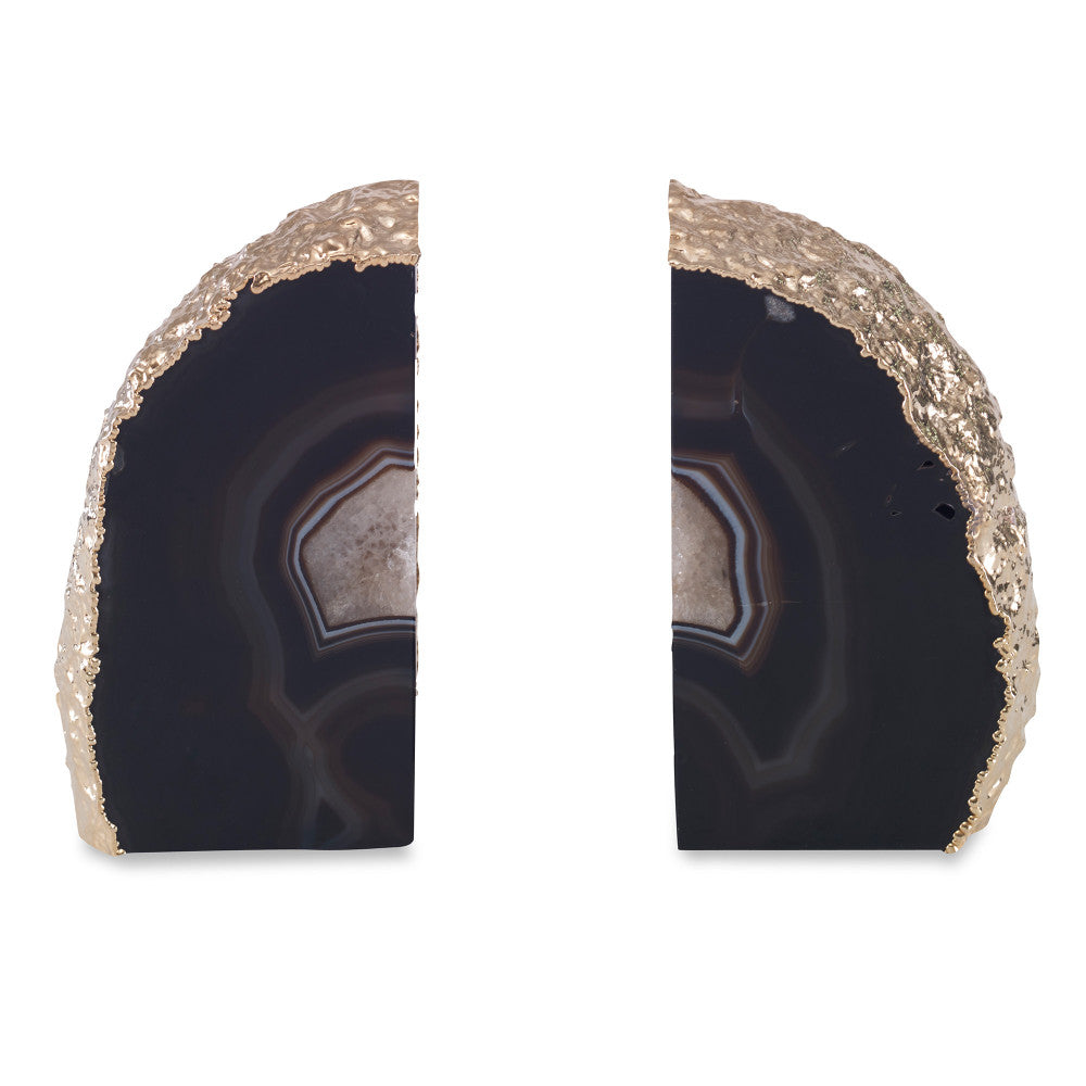 Franca Bookends, Black QR-18878.BLACKGLD.0 by CuratedKravet CuratedKravet A pair of black agate bookends, detailed with gold electroplated edges. Due to the natural material, size, shape and color will vary. Measures: 4.75"-6.75"L x 1.5"-2.75"W x 6.75"H Brazil DUST LIGHTLY. </p><p>Dimensions: Length 2.5, Height 6.75, Width 5 Stone - 90%, Gold - 10% - Fabric Carolina -