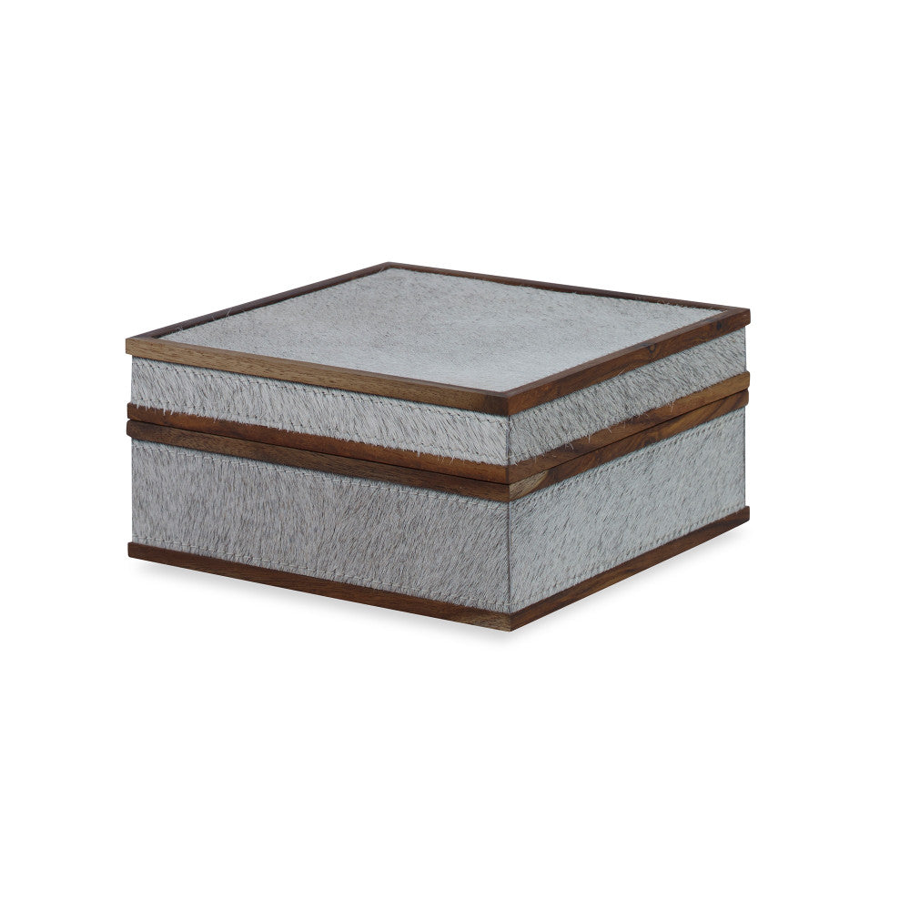 Hobart Box, Small QR-18887.NATGRAY.0 by CuratedKravet CuratedKravet A handmade box made with hair on hide and detailed with wood trim accents. India DUST LIGHTLY. </p><p>Dimensions: Length 6, Height 3, Width 6 Mdf - 50%, Cow Hide - 40%, Wood - 10% - Fabric Carolina -