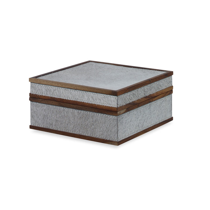 Hobart Box, Small QR-18887.NATGRAY.0 by CuratedKravet CuratedKravet A handmade box made with hair on hide and detailed with wood trim accents. India DUST LIGHTLY. </p><p>Dimensions: Length 6, Height 3, Width 6 Mdf - 50%, Cow Hide - 40%, Wood - 10% - Fabric Carolina -