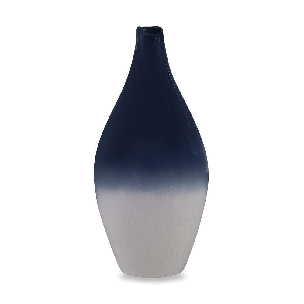 Wigmore Vase QR-19161.INDIGOIVRY.0 by CuratedKravet CuratedKravet A ceramic vase with a finely crafted, balanced shape, glazed with an inky, glossy, indigo blue on the upper portion, followed by a creamy ivory crackled appearance on the lower. Each vase is unique. Made in the USA. This item is decorative and not meant to hold water or food. United States DUST LIGHTLY WITH A DRY OR SLIGHTLY DAMP LINT-FREE CLOTH. </p><p>Dimensions: Length 8, Height 17, Width 8 Ceramic - 100% - Fabric Carolina -