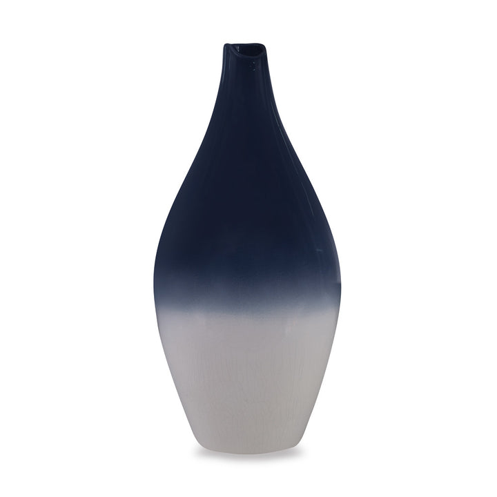 Wigmore Vase QR-19161.INDIGOIVRY.0 by CuratedKravet CuratedKravet A ceramic vase with a finely crafted, balanced shape, glazed with an inky, glossy, indigo blue on the upper portion, followed by a creamy ivory crackled appearance on the lower. Each vase is unique. Made in the USA. This item is decorative and not meant to hold water or food. United States DUST LIGHTLY WITH A DRY OR SLIGHTLY DAMP LINT-FREE CLOTH. </p><p>Dimensions: Length 8, Height 17, Width 8 Ceramic - 100% - Fabric Carolina -