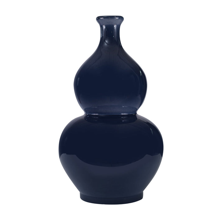Dewart Vase QR-19170.INDIGO.0 by CuratedKravet CuratedKravet A curvy, double gourd ceramic vase featuring an inky, glossy, indigo blue hand glazed finish. Each piece is one of a kind. Made in the USA. This item is decorative and not meant to hold water or food. United States DUST LIGHTLY WITH A DRY OR SLIGHTLY DAMP LINT-FREE CLOTH. </p><p>Dimensions: Length 12, Height 21, Width 12 Ceramic - 100% - Fabric Carolina -