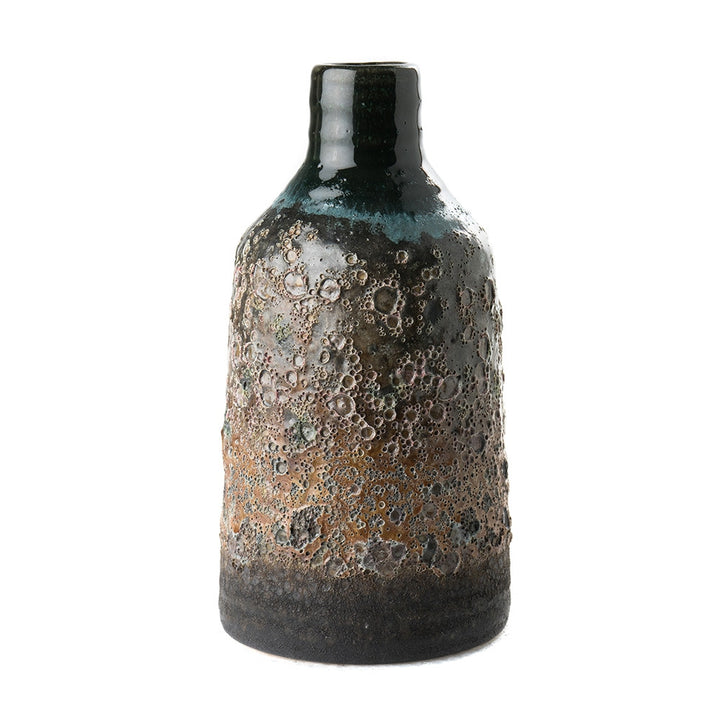 Blaine Vase QR-19208.MULTI.0 by CuratedKravet CuratedKravet A stoneware vase featuring a unique blue volcanic finish. Due to the handmade nature of this vase, variation is to be expected. China DUST LIGHTLY. </p><p>Dimensions: Length 4.25, Height 4.75, Width 4.25 Ceramic - 100% - Fabric Carolina -