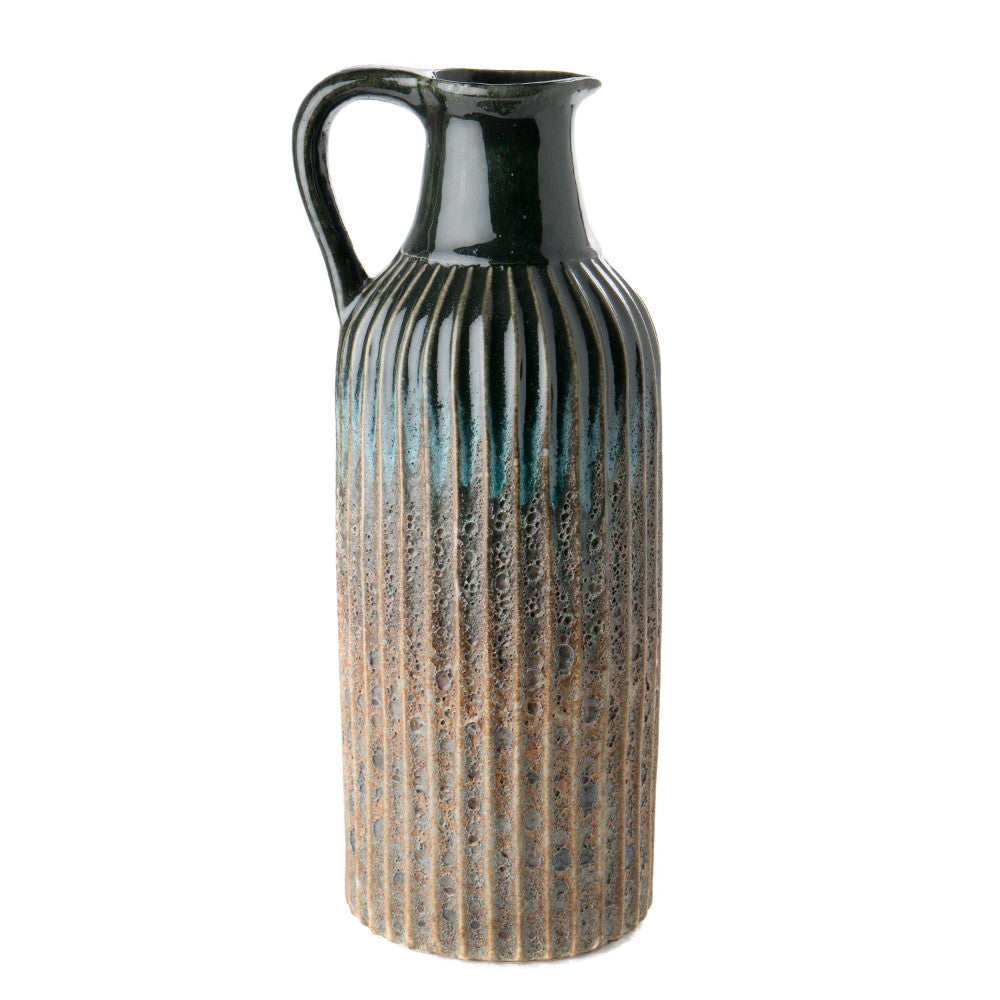 Libby Pitcher QR-19210.MULTIBLU.0 by CuratedKravet CuratedKravet A stoneware pitcher featuring a unique blue volcanic finish. Due to the handmade nature of this piece, variation is to be expected. China DUST LIGHTLY. </p><p>Dimensions: Length 6.25, Height 14.5, Width 5.25 Ceramic - 100% - Fabric Carolina -