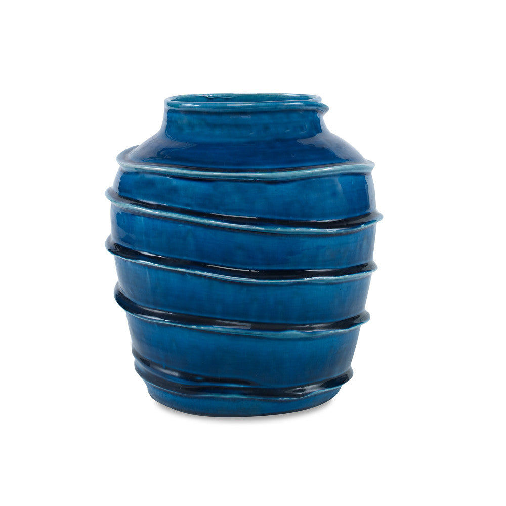 Kasey Vase QR-19338.DRKBLUE.0 by CuratedKravet CuratedKravet A decorative earthenware vase with a reactive blue crackled glaze. Each vase is handmade and unique. This vase is not watertight. Portugal DUST LIGHTLY. </p><p>Dimensions: Length 8.5, Height 9.75, Width 8.5 Ceramic - 100% - Fabric Carolina -