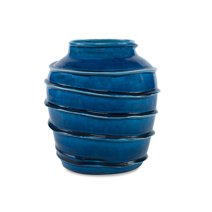 Kasey Vase QR-19338.DRKBLUE.0 by CuratedKravet CuratedKravet A decorative earthenware vase with a reactive blue crackled glaze. Each vase is handmade and unique. This vase is not watertight. Portugal DUST LIGHTLY. </p><p>Dimensions: Length 8.5, Height 9.75, Width 8.5 Ceramic - 100% - Fabric Carolina -