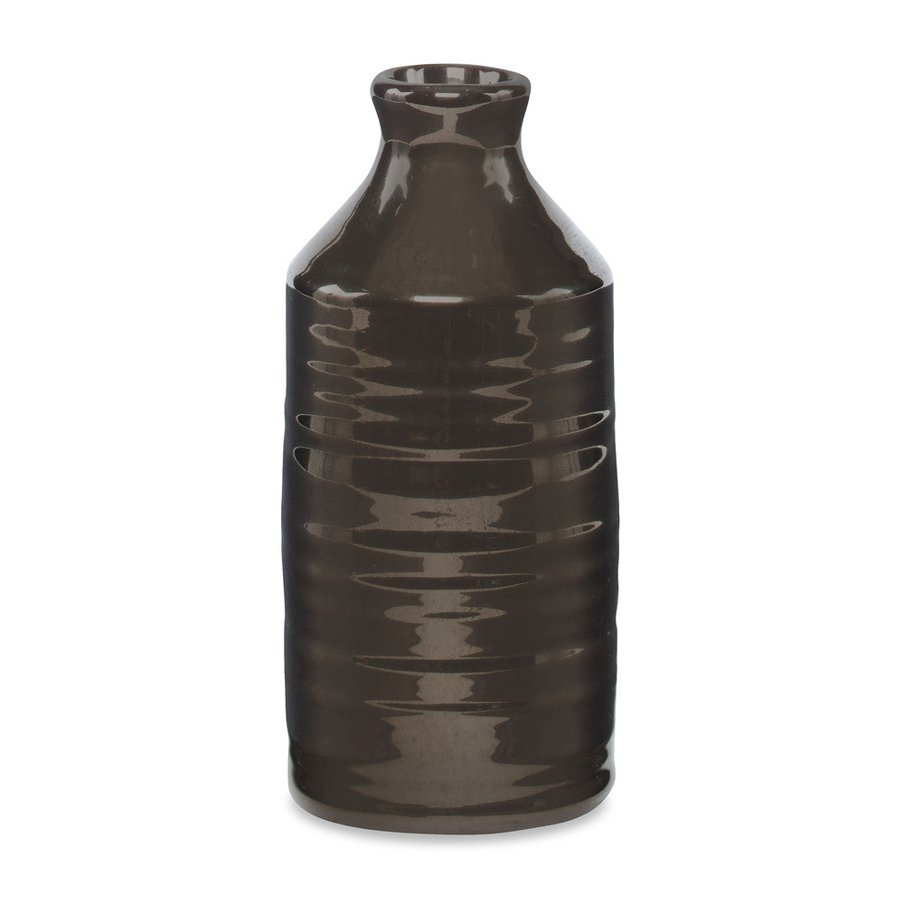Crossway Vase, Large QR-19368.GOLD.0 by CuratedKravet CuratedKravet A decorative earthenware bottle vase with a reactive gold glaze. Each vase is handmade and unique. This vase is not watertight. Portugal DUST LIGHTLY. </p><p>Dimensions: Length 3.25, Height 8.25, Width 3.25 Ceramic - 100% - Fabric Carolina -