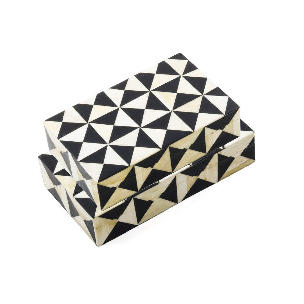 Minnie Box Set QR-20173.IVRYBLK.0 by CuratedKravet CuratedKravet A set of 2 ivory and black decorative resin boxes featuring a playful pattern of contrasting triangles. Measures, Small: 8"L x 5"W x 2"H; Large: 9"L x 5"W x 2"H India DUST LIGHTLY WITH A SOFT, DRY CLOTH. </p><p>Dimensions: Length , Height , Width Mdf - 50%, Poly Resin - 50% - Fabric Carolina -