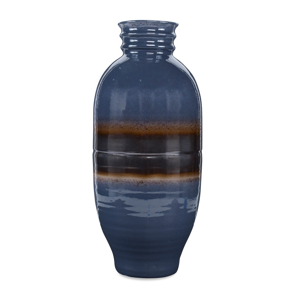Bruin Vase QR-20224.LAPISGRAY.0 by CuratedKravet CuratedKravet A ceramic vase featuring a unique reactive glaze pairing in which lapis blue glaze reacts with a bronze glaze. Each piece is one of a kind. Made in the USA. This item is decorative and not meant to hold water or food. United States DUST LIGHTLY WITH A SOFT, DRY CLOTH. </p><p>Dimensions: Length 9.5, Height 21, Width 9.5 Ceramic - 100% - Fabric Carolina -