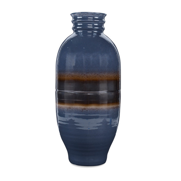 Bruin Vase QR-20224.LAPISGRAY.0 by CuratedKravet CuratedKravet A ceramic vase featuring a unique reactive glaze pairing in which lapis blue glaze reacts with a bronze glaze. Each piece is one of a kind. Made in the USA. This item is decorative and not meant to hold water or food. United States DUST LIGHTLY WITH A SOFT, DRY CLOTH. </p><p>Dimensions: Length 9.5, Height 21, Width 9.5 Ceramic - 100% - Fabric Carolina -