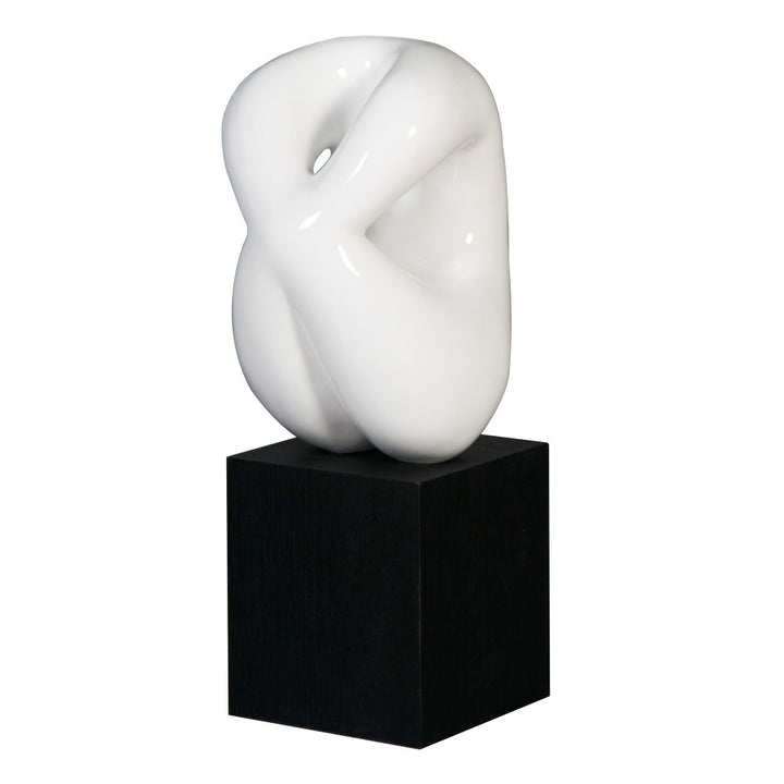 Phelps Sculpture QR-20446.WHTBLK.0 by CuratedKravet CuratedKravet A glossy white abstract resin sculpture, mounted on a large black base. China DUST LIGHTLY WITH A SOFT, DRY CLOTH. </p><p>Dimensions: Length 9.75, Height 25.5, Width 9.75 Poly Resin - 60%, Wood - 40% - Fabric Carolina -