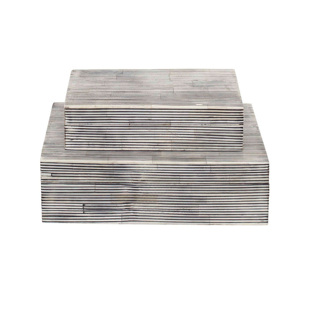 Ran Bone Box, Large QR-20496.BLACKWHITE.0 by CuratedKravet CuratedKravet Lidded box handcrafted and made from genuine bone. Due to the handmade nature of the product, variation is to be expected. India DUST LIGHTLY WITH A SOFT, DRY CLOTH. </p><p>Dimensions: Length 10, Height 3, Width 7 Bone - 90%, Mdf - 10% - Fabric Carolina -