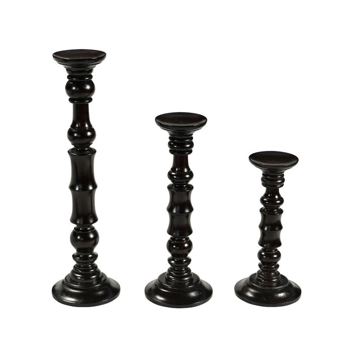 Denise Candlesticks, Set Of 3 QR-20957.DRKBRWN.0 by CuratedKravet CuratedKravet A set of three wooden candlesticks. Small: 6.5"L x 6.5"W x 14"H; Medium: 6.75"L x 6.75"W x 18"H; Large: 7"L x 7"W x 24"H. India Dust lightly with a soft, dry cloth. </p><p>Dimensions: Length , Height , Width Wood - 100% - Fabric Carolina -