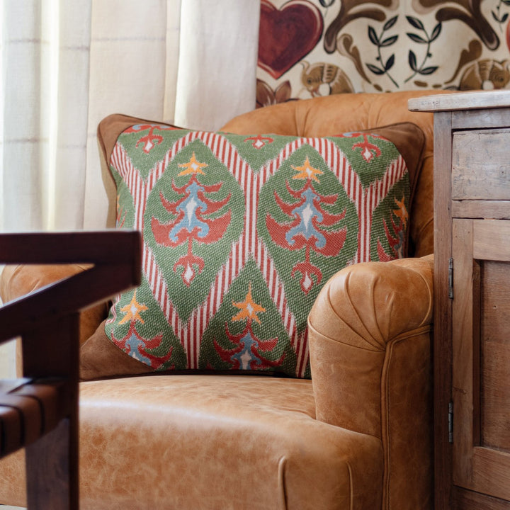 TANNENBAUM Cushion (LC40187) by Mind The Gap | LC40187 | TYROL APRES-SKI HOME COLLECTION | 20 x 20 in | Blue, Green, Red, Yellow | Fabric Carolina | https://www.fabriccarolina.com/